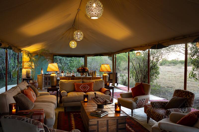 The mess lounge in the afternoon, deep sofas and Persian rugs