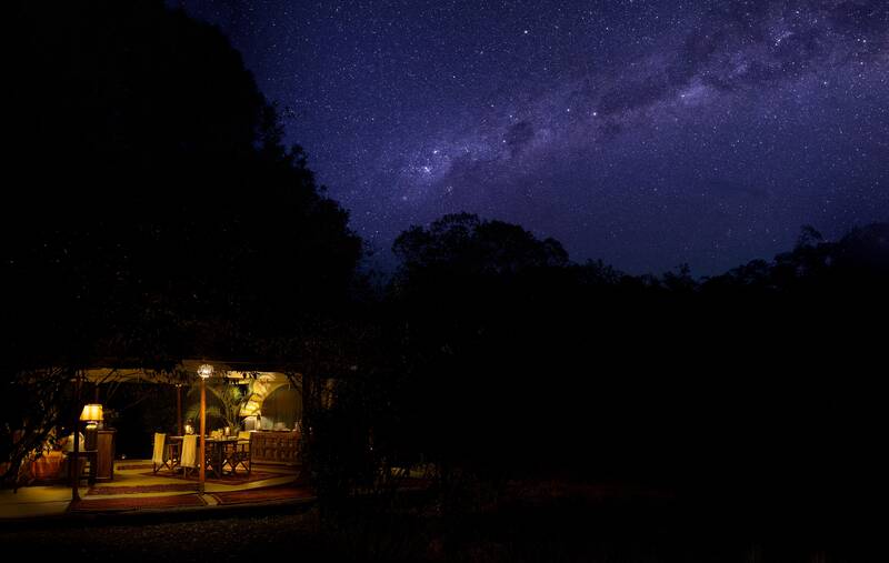 Seringet lit up at night under the Milky Way