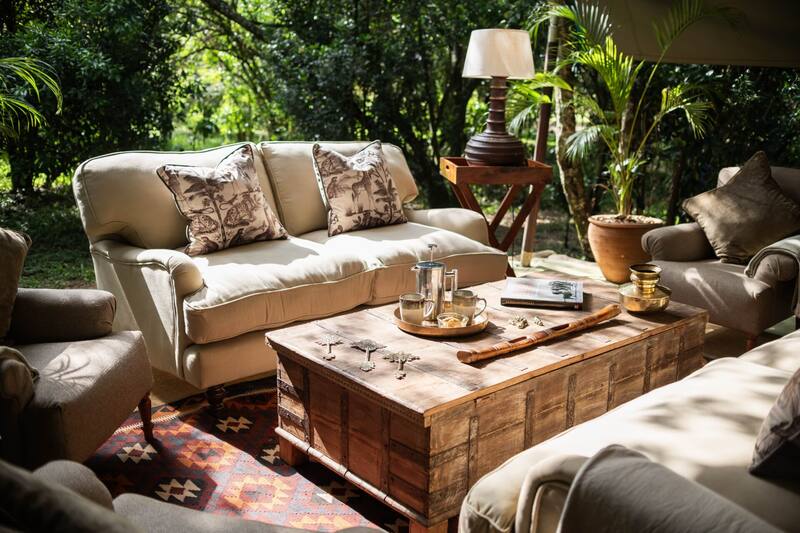 Inside the mess lounge — Persian rugs, candles, deep sofas