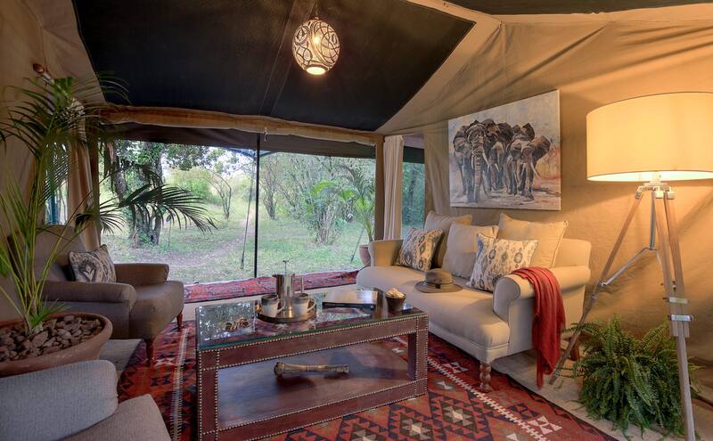 Family suite lounge at dusk, sofas drawn around the lamps